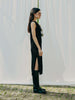 Sassy net knit dress crafted in Switzerland, featuring a classic round neckline, fitting armholes, and stylish side slits, made from organic cotton, perfect for evening wear or summer outings over swimwear